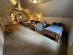 Bedroom 3 with 4 twin beds walk through upper Master to this room